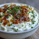 Warm Smoked Gouda & Onion Dip served with crunchy tortilla chips for dipping