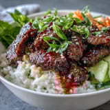 Colorful Korean Beef Power Bowl with fluffy rice, crisp cucumbers, and spicy jalapeños for dinner.
