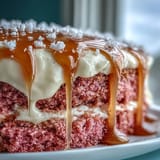 Luscious Rosé Velvet Cake for celebrations, featuring a shimmering edible gold drip.