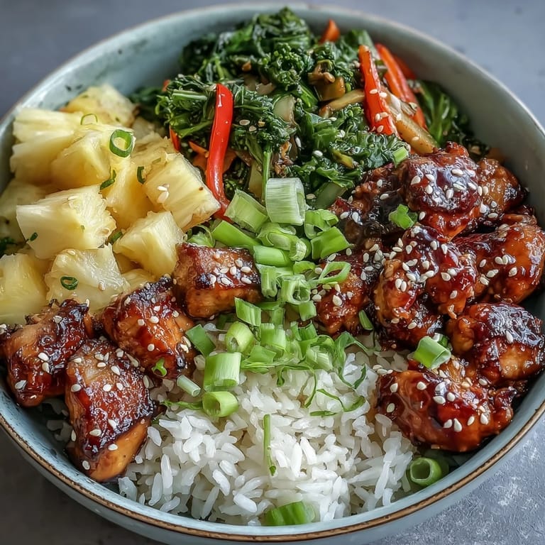 Healthy Teriyaki Chicken and Rice Bowl served steaming hot, featuring juicy chicken, crisp broccoli, and sweet pineapple in a single dish.
