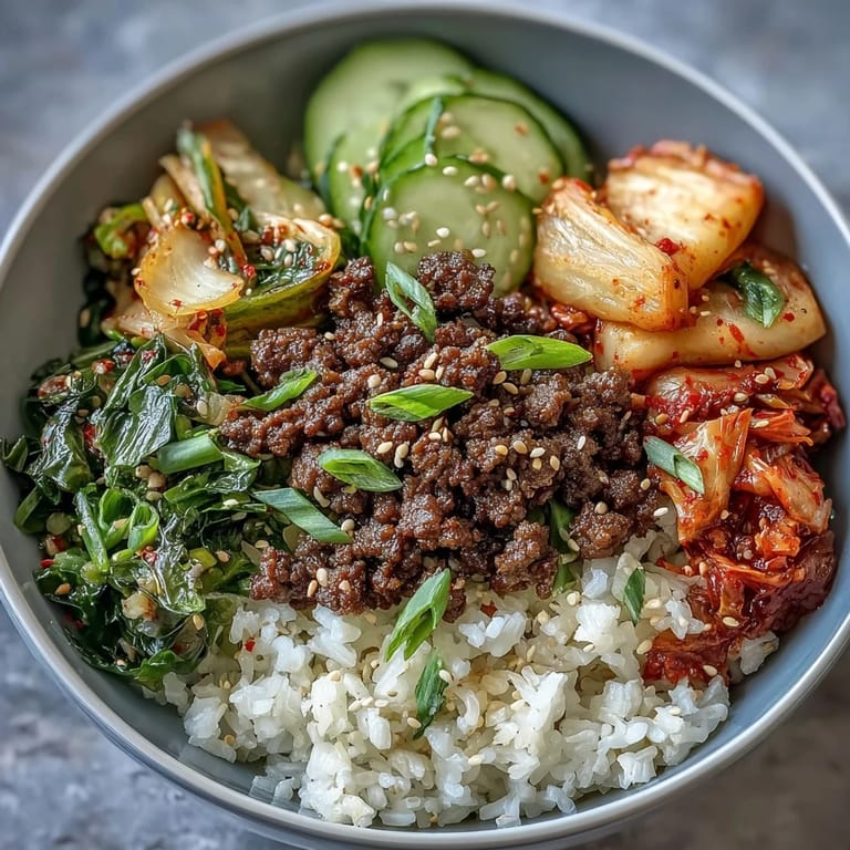 Vibrant Korean Beef Bowl featuring seasoned ground beef, pickled veggies, and sesame garnish.